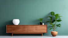 A Green Wall With A Wooden Cabinet And A Plant In A Pot And A Hanging Planter On The Wall