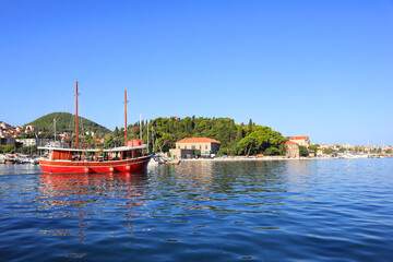 Wall Mural - Marina with red ship in sunny day in Dubrovnik, Croatia 