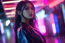 Young Fashionable Asian Girl Looks At The Camera, Against The Background Of Neon Light