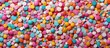 Colorful sprinkles create a seamless candy background in this pattern