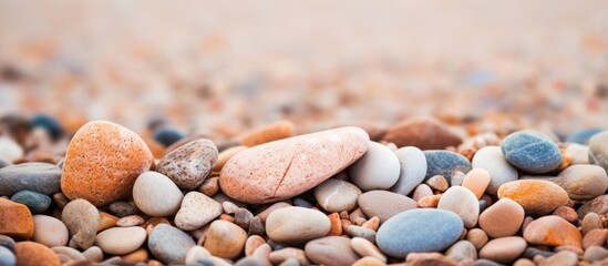 Sticker - A small brown rock in front of a textured background with a brown tone found on the beach