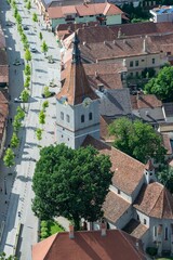 Quaint town, featuring a traditional cobblestone street leading to a spectacular Gothic cathedral