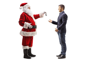 Poster - Full length profile shot of santa claus giving a car key to a young man