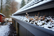 Clogged Gutter On The Roof With Dirt, Debris And Fallen Leaves Does Not Allow Rainwater To Drain Properly.