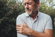 Portrait of a man experiencing shoulder pain