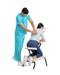 Canvas Print - Woman receiving massage in modern chair on white background