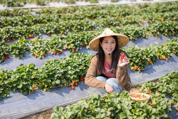 Canvas Print - Woman visit the strawberry farm