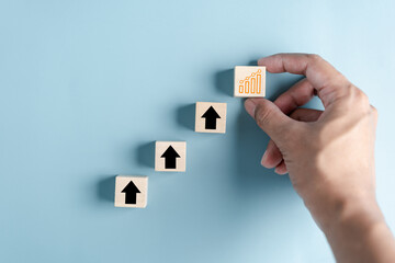 Aufkleber - Hand holding  woodblock analysis portfolio management, Steps planning for development and business concept.