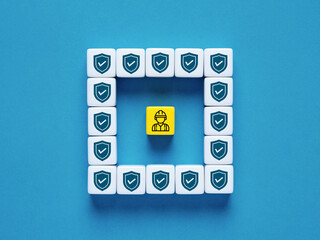 Worker safety and protection. Work safety first. Worker symbol surrounded by shield icons.