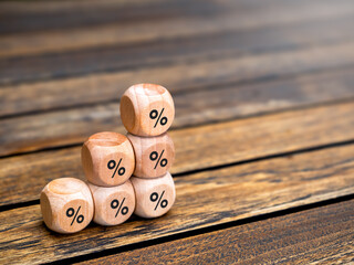Poster - Percentage icon on wooden cube blocks build as business chart steps on wood table background with copy space. Business growth graph process, interest rate finance and mortgage rates concepts.