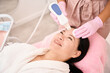 © Svitlana - Woman undergoing ultrasonic facial cleansing in a cosmetology salon