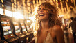 Woman having fun and laughing with blurred slot machines and casino  in the background. Sun back lights her hair. 
