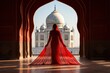 Portrait of young Indian woman model in red sari in Taj Mahal Agra Uttar Pra
