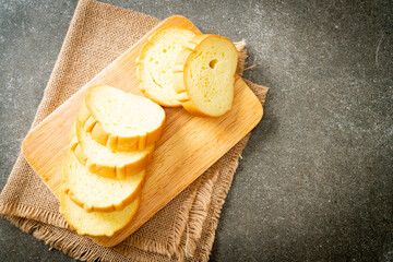 Wall Mural - potatoes bread sliced on wood board