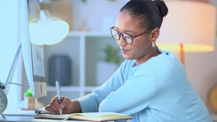 Aufkleber - Young remote learner studying for a university test or college assignment. Female student writing notes and doing research for an academic essay or article while sitting at a computer desk inside.