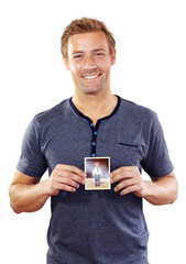 Holding photograph, happy and portrait of man with picture as child for memory, nostalgia and past. Smile, white background and person with photo to remember childhood, youth and young self in studio