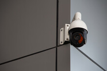 Outdoor Surveillance Camera Installed On The Corner Of A Modern Building. High Quality Photo