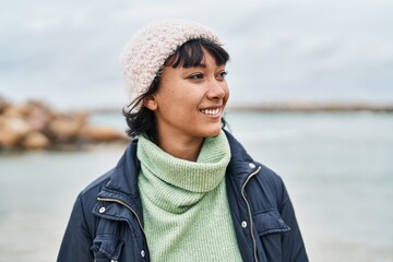 Poster - Young beautiful hispanic woman smiling confident standing at seaside