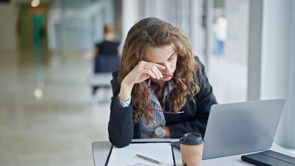 Canvas Print - Young woman business worker tired working at the office