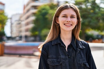 Canvas Print - Young blonde woman smiling confident standing at park