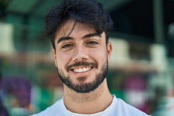 Poster - Young hispanic man smiling confident standing at street