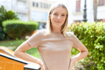 Poster - Young blonde woman smiling confident standing at park