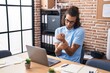 © Krakenimages.com - Young hispanic man business worker suffering for wrist pain working at office