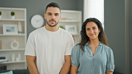 Poster - Man and woman couple standing together smiling at home