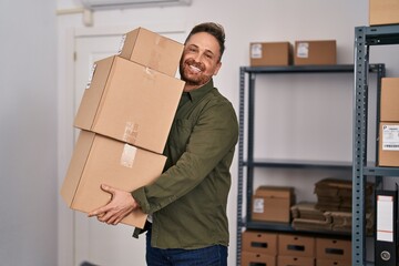 Poster - Young caucasian man ecommerce business worker holding packages at office