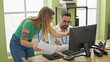© Krakenimages.com - Man and woman business workers using computer holding document at office