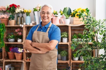 Poster - Middle age grey-haired man florist smiling confident standing with arms crossed gesture at florist