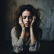 © Martin - Woman with hands in hair looking depressed dark, lonely sad with anxiety mental health problem, worried.