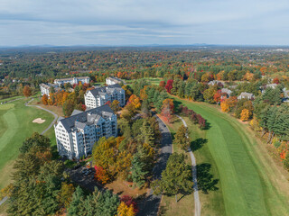 Poster - aerial view of apartment community beside golf course in autumn