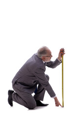 Old businessman holding tape measure isolated on white