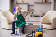 © Elnur - Old male contractor cleaning the house
