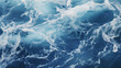 Blue and crystalline water. Waves in the ocean. View from above. Textured background.