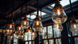 Old style halogen lamps hanging from the ceiling of a modern cafe