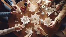 A Group Of Friends Making Paper Snowflakes.