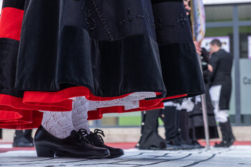 close-up of the feet of a woman dressed in traditional costume from Galicia. Spain