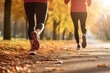 © Stavros - Couple during jogging workout in an autumn city park. Keeping fit in any age. Cropped image. Legs close-up.