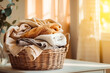 laundry in a wicker basket for washing in the room. towel. peach fuzz background.
