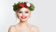 © millaf (Nemchinova) - Attractive blonde woman portrait. Fashion female model with blond curly hairstyle, make-up and green and red winter accessories posing on white background