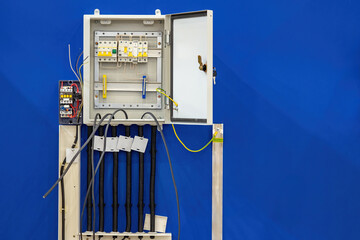 Poster - open power panel. electric transformer. power shield on blue wall. electrical equipment. industrial 