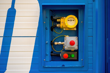Poster - hatch with electrical equipment in wall container. buttons for emergency power off. industrial techn