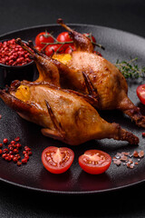 Roasted quail, partridge or pigeon stuffed with orange with spices and herbs