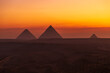 The Great Pyramids of Egypt at dawn.