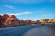 Road running through the desert in The Valley of Fire State Park located near Las Vegas Nevada. at sunset.