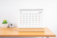 January Monthly Desk Calendar For 2024 Year And Alarm Clock.