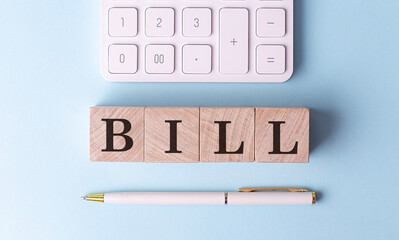 Poster - BILL on wooden cubes with pen and calculator, financial concept