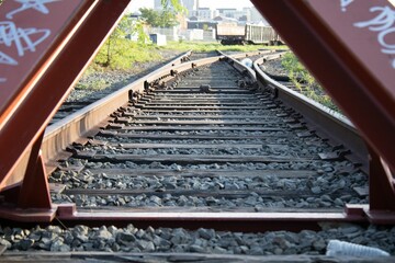 view of a railway track situated between two red posts